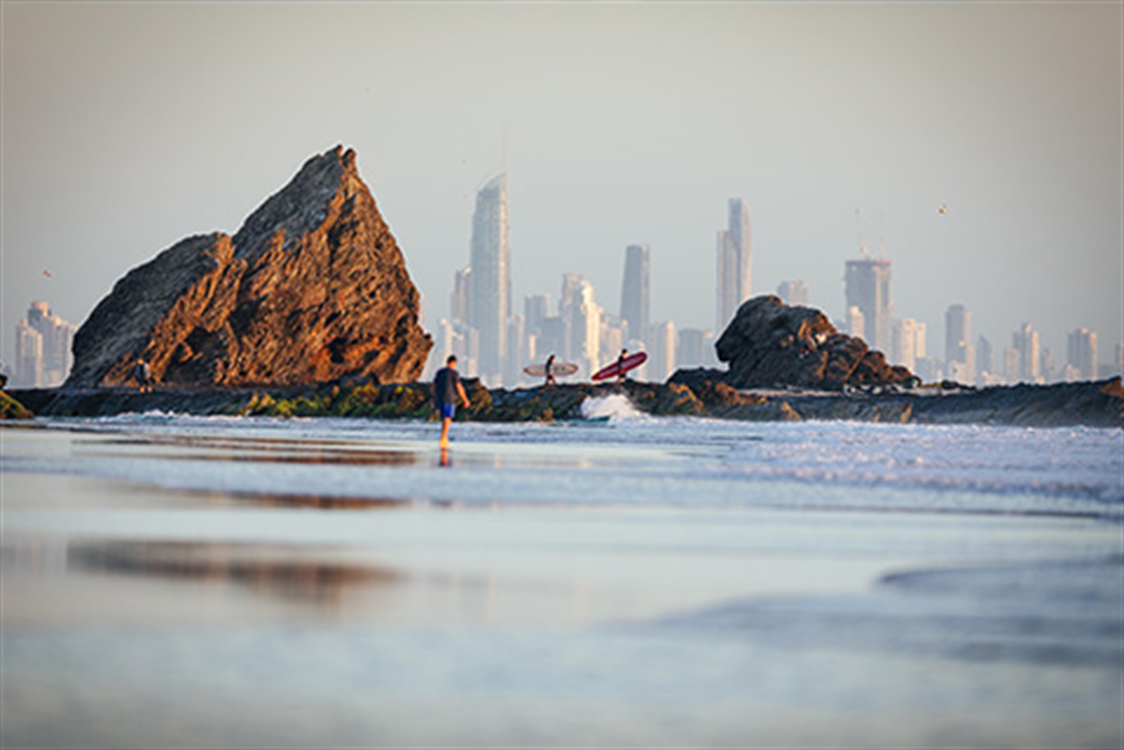 early-mornings-elanora-sunrise Early morning light on Elephant Rock at Currumbin Beach with surfers on the sand near Elanora