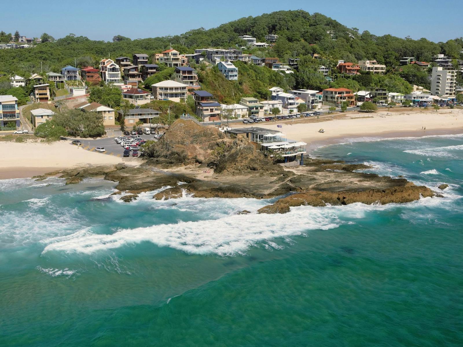 free-things-to-do-near-elanora Aerial view of Currumbin Beach, Elephant Rock headland and the surf on the southern Gold Coast